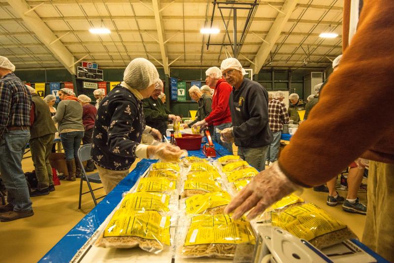 Looking down the assembly line Sunday at the Damariscotta YMCA at the "End Hunger in New England" event put on by the Boothbay Harbor and Damariscotta-Newcastle Rotary clubs. Courtesy of Steve Demeranville