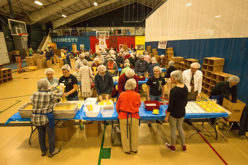 Volunteers assembling food packets for needy families Sunday at the Damariscotta YMCA at the "End Hunger in New England" event put on by the Boothbay Harbor and Damriscotta-Newcastle Rotary clubs. Courtesy of Steve Demeranville