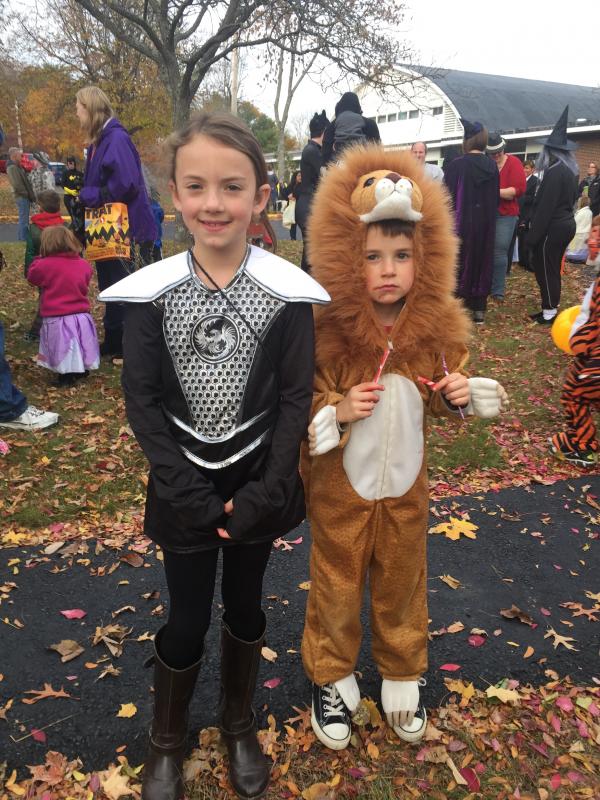 Karlie Reith, 9, of Dresden and brother Kayden Reith, 6, having a treat, await the parade’s start. Their father, Jay Reith, accompanied them. SUSAN JOHNS/Wiscasset Newspaper
