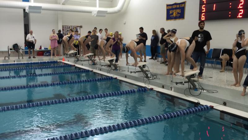 Girls get ready for the 50-yard freestyle event. KATRINA CLARK/Wiscasset Newspaper