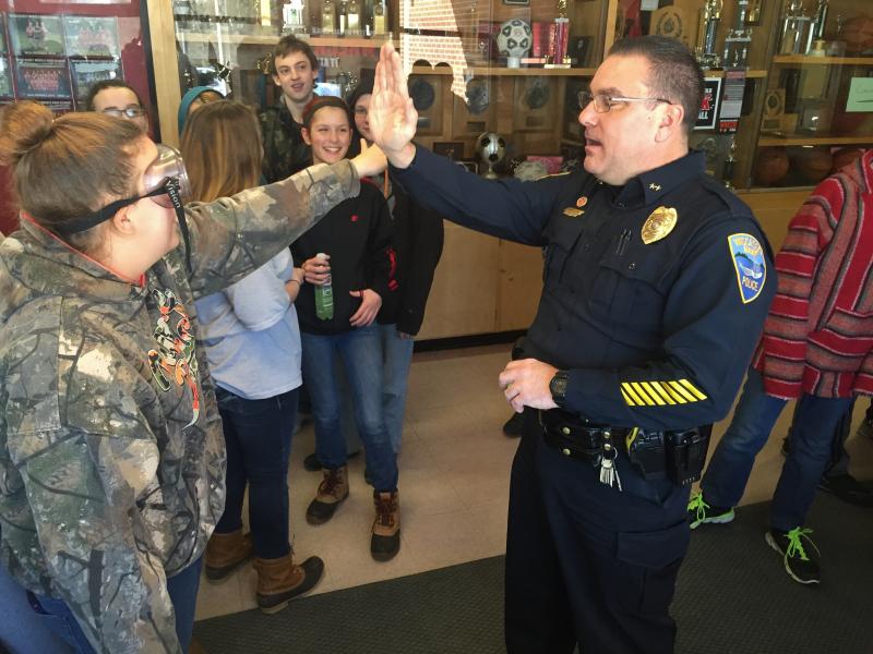 WMHS seventh grader Joanna Collins attempts a high five with Wiscasset Police Chief Troy Cline on Jan. 21 while she has on goggles that simulate impairment. Story on the “Dare to Prepare” teen driving safety program, page 1. SUSAN JOHNS/Wiscasset Newspaper