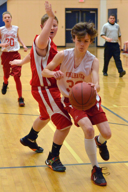 Action from the Busline small school championship between Wiscasset and Vinalhaven. After a close, hard fought battle Wiscasset was able to capture the 52-50 win. (Photo by Ron Hawkes)