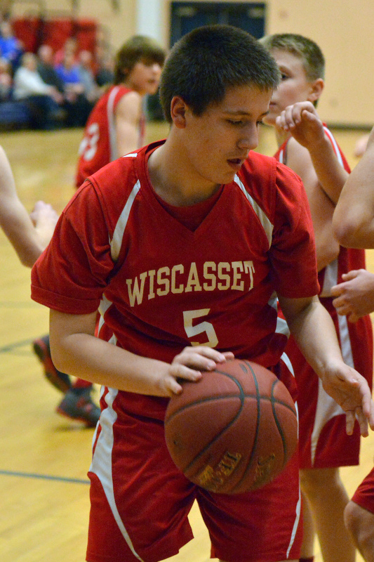 Action from the Busline small school championship between Wiscasset and Vinalhaven. After a close, hard fought battle Wiscasset was able to capture the 52-50 win. (Photo by Ron Hawkes)