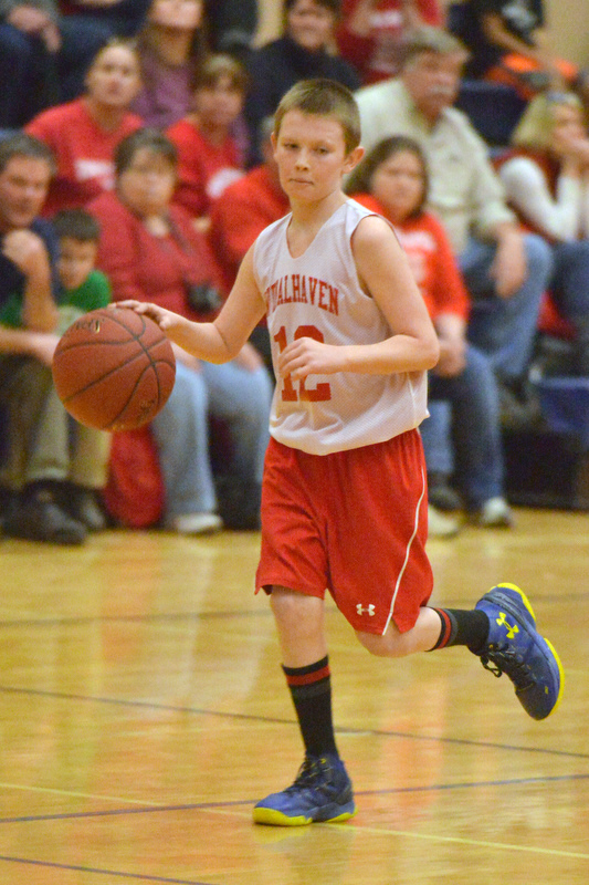 Action from the Busline small school championship between Wiscasset and Vinalhaven. After a close, hard fought battle Wiscasset was able to capture the 52-50 win. (Photo by Ron Hawkes)