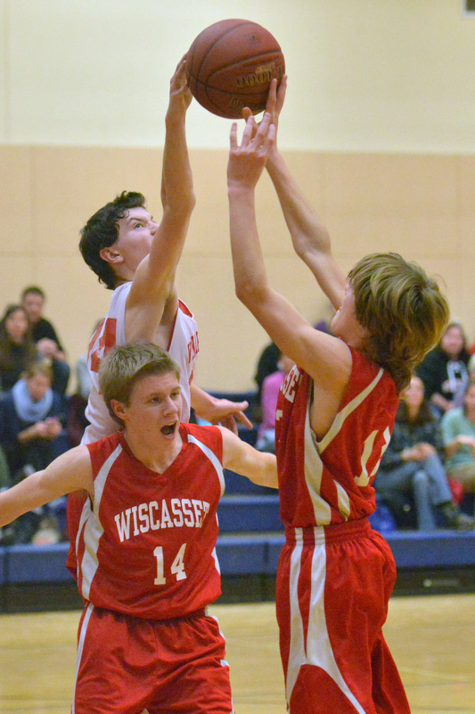 Action from the Busline small school championship between Wiscasset and Vinalhaven. After a close, hard fought battle Wiscasset was able to capture the 52-50 win. (Photo by Ron Hawkes)