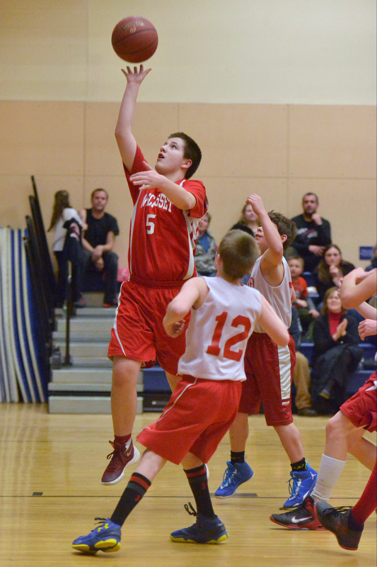 Action from the Busline small school championship between Wiscasset and Vinalhaven. After a close, hard fought battle Wiscasset was able to capture the 52-50 win. (Photo by Ron Hawkes)
