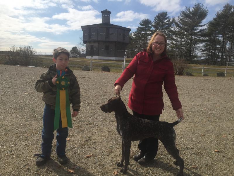 Zachary Poland, 11, of Edgecomb and his mother Lenore Parsons pose at Fort Edgecomb Feb. 18 with their German shorthaired pointer Gemma and the merit award the dog just earned at Westminster. SUSAN JOHNS/Wiscasset Newspaper