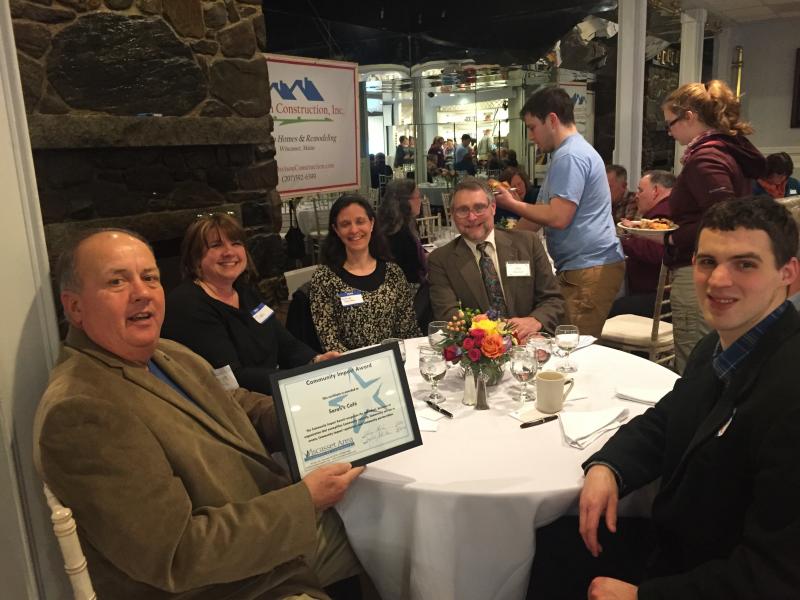 Stephen Heald, brother of Sarah’s Cafe owner Sarah Heald, shows the Community Impact Award his sister’s business won March 3 at the Wiscasset Area Chamber of Commerce’s annual dinner. At right, Sarah’s Cafe employee Josh Pottle. SUSAN JOHNS/Wiscasset Newspaper