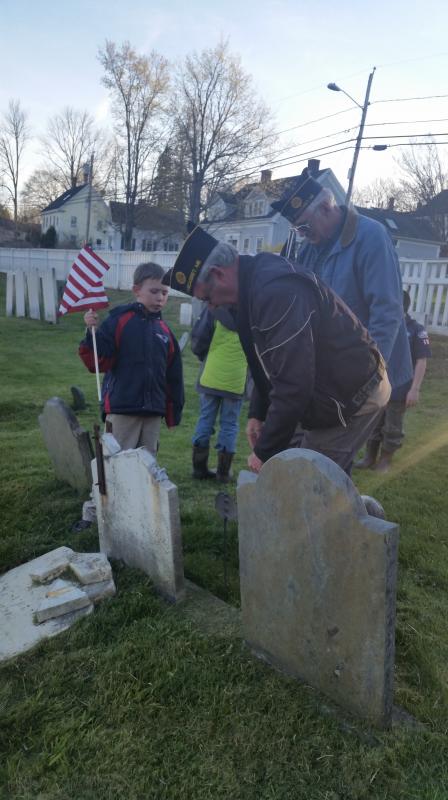 Scout Garrett Marshall with Legion members John Kennedy (bending over) and William Cossette Jr. Courtesy of Cub Master Susanne Smith-Pinkham of Wiscasset