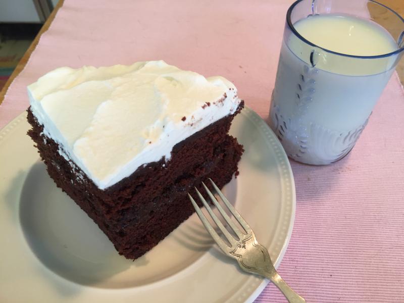 Chocolate Town Fudge Cake with Elegant Frosting and whipped cream. And a glass of milk, of course. SUZI THAYER/Boothbay Register
