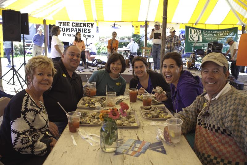 Guests at a past Pemaquid Oyster Festival enjoy oysters fresh from the Damariscotta River under the cover of a tent provided by Renys. The tent allows the festival to go regardless of weather conditions. This year the Pemaquid Oyster Festival is scheduled for Sunday, Sept. 25 from noon to dusk. Courtesy of Greg Latimer