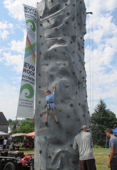 Nate Spaulding, 5, of Bath gives the EVO climbing wall a try. PHIL DI VECE/Wiscasset Newspaper