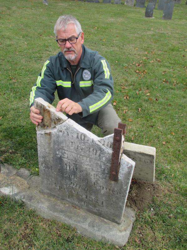 A number of the gravestones in the Ancient Cemetery have undergone past repairs. This one marking the grave of Col. Ezekiel Cutter was previously held together by iron braces. PHIL DI VECE/Wiscasset Newspaper