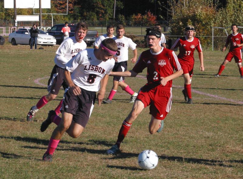 Brandon Goud #2 and Lisbon’s Nick Lerette. PHIL DI VECE/Wiscasset Newspaper