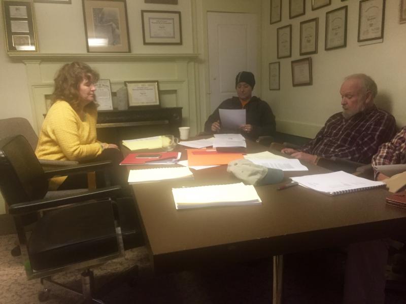 Departing Alna Town Clerk Lisa Arsenault, left, takes part in selectmen’s April 12 meeting. Pictured are Second Selectman Melissa Spinney, center, and First Selectman David Abbott. SUSAN JOHNS/Wiscasset Newspaper