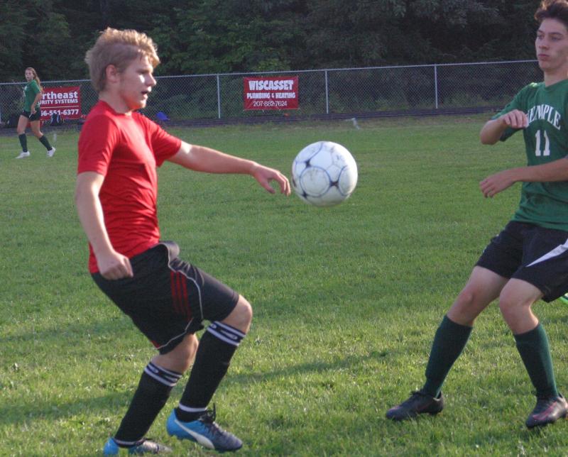 Wiscasset’s Josh Jones takes on Temple Academy’s Will Paradis during a scrimmage Aug. 23. PHIL DI VECE/Wiscasset Newspaper