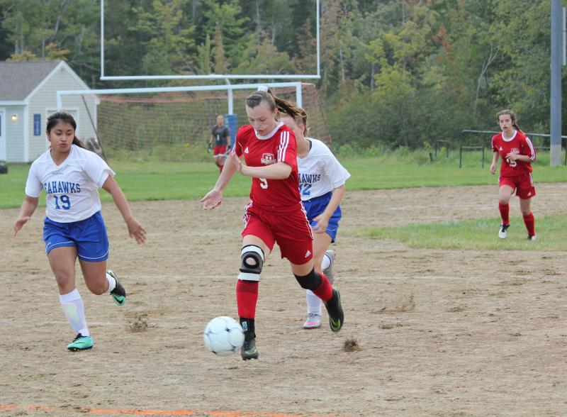 Grace Webber heads for the goal during Tuesday’s match. Webber scored Wiscasset’s second goal of the night. SUE MELLO/Boothbay Register
