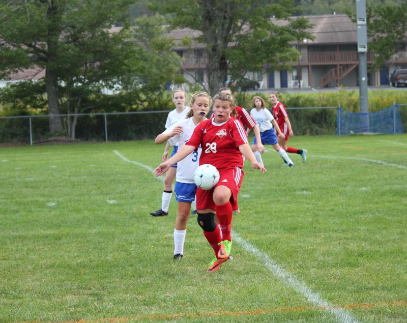Lily Souza handles the ball in front of the net. Souza scored two goals for Wiscasset against Boothbay. SUE MELLO/Boothbay Register