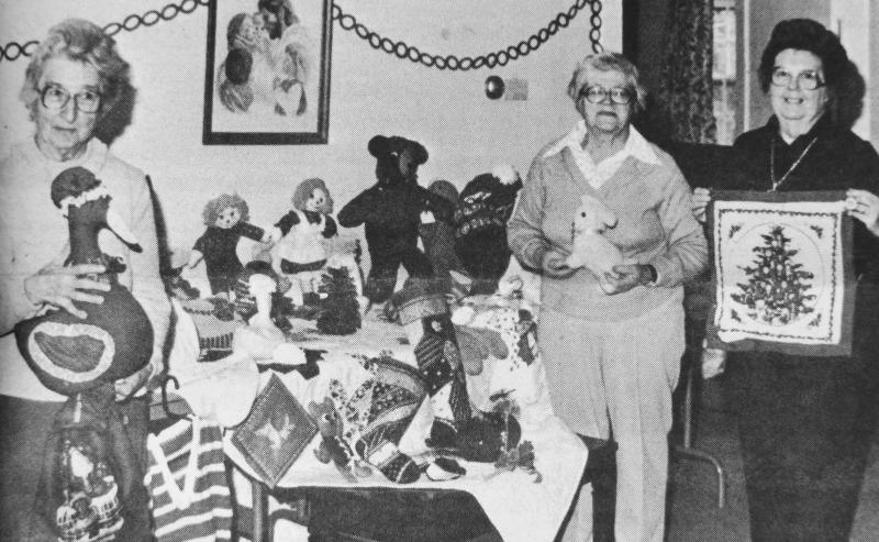 This newspaper picture from 1985 shows three past members of the Ladies Organ Society, from left, Betty Stetson, Ruth Applin and Marj Morris posing with items to be sold at the Christmas Fair. Along with baked goods, stuffed toys and knitted items the fair featured a turkey shortcake lunch including coffee and dessert for $2.75. Courtesy of PHIL DI VECE
