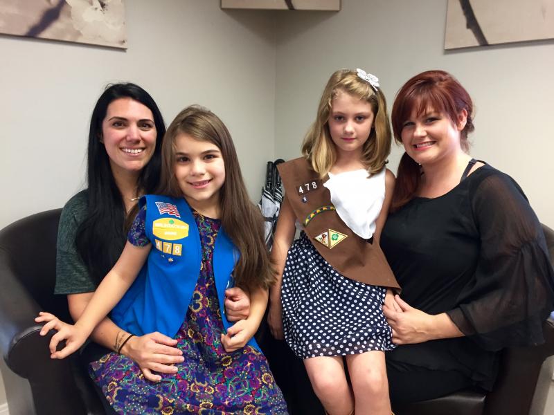 From left, Kelly Tochterman, daughter Presley, Emma Bailey and her mother Desiree Bailey, all of Wiscasset pose Sept. 21 after talking about the Sept. 30 Girl Scouts bottle drive that will be part of Possibilities Salon’s open house-community block party. Presley still wears her Daisy’s vest while awaiting the brown sash of her new status as a Brownie. SUSAN JOHNS/Wiscasset Newspaper