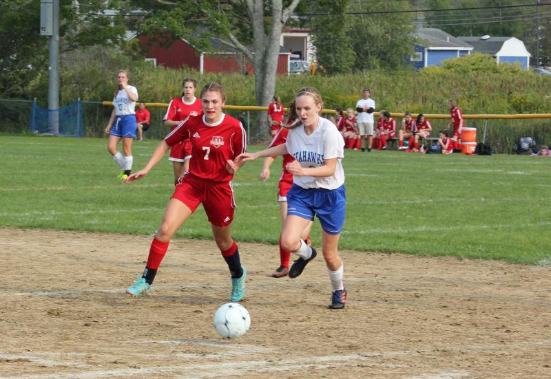 Vanessa Dunn battles for the ball during Tuesday’s game at Boothbay. Dunn scored Wiscasset’s fifth and final goal in the second half to seal the Wolverines’ 5-2 win. SUE MELLO/Boothbay Register