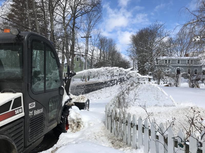Equipment spurts out snow being removed from the Federal Street, Wiscasset sidewalk March 9, a day after several inches fell. SUSAN JOHNS/Wiscasset Newspaper