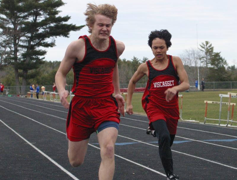 Junior Matt Chapman, left, and Cedrick Loyola run neck and neck in the 100-meter dash at the alumni meet. PHIL DI VECE/Wiscasset Newspaper