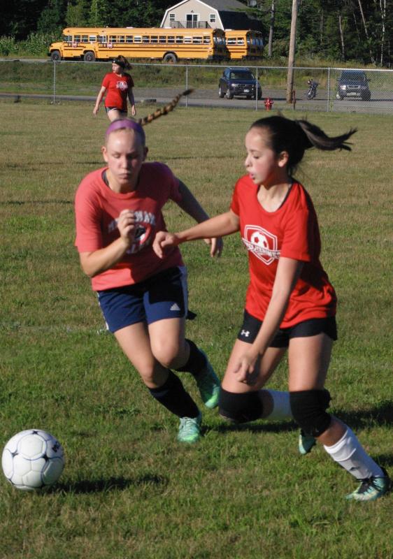 Wiscasset’s Chrissy Easter, right, plays in the opening minutes of the game. PHIL DI VECE/Wiscasset Newspaper