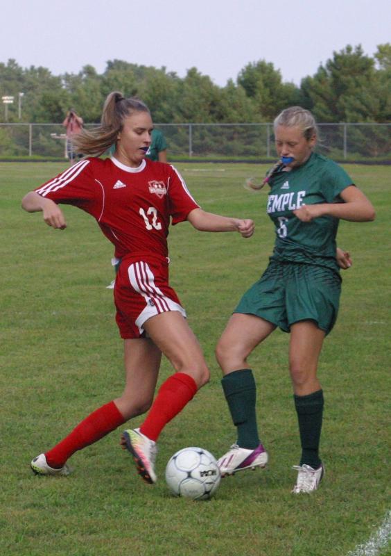 Wolverine Alyssa Bassett and Temple Academy’s Hannah Hubbard. PHIL DI VECE/Wiscasset Newspaper