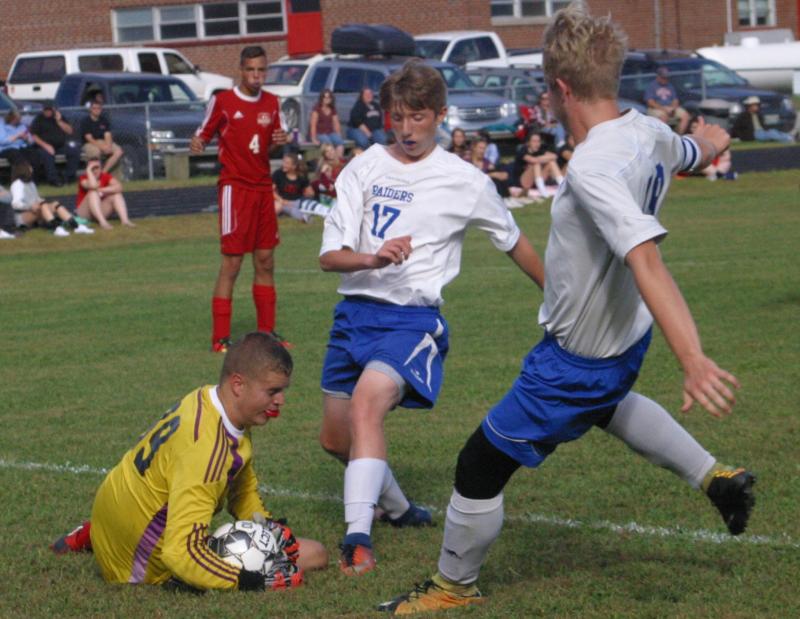 Caleb Gabriele hits the turf for a save in the first half of Friday afternoon’s game with Oak Hill. Also shown is Raider Caleb Leighton #17. PHIL DI VECE/Wiscasset Newspaper