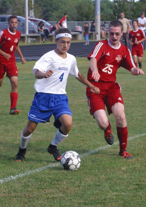 Matt Smith in pursuit of Levi Sturtevant. PHIL DI VECE/Wiscasset Newspaper