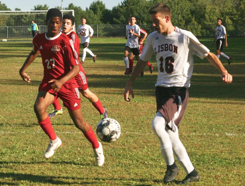 Wiscasset/Boothbay’s Jordan Espeut and the Greyhound’s Cameron Poisson. PHIL DI VECE/Wiscasset Newspaper