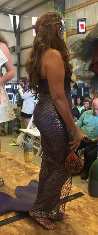 “Purple Reign” – model/co-designer Luanne Webb wears an intricate mosaic of hand painted and dyed netting, rope and seaweed pods – used as beading. Homemade shoes use cork and cording; evening clutch adorned with rope and seaweed pod beading.