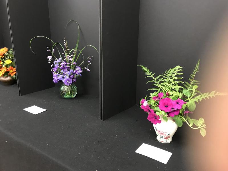 The Garden Club of Wiscasset holds a flower design class at 11 a.m. before most meetings. Participants prepare the scheduled design, assist each other, and learn from mentors and group critiques. September's theme was a monochromatic design. Pictured are lovely results. A design using dried plant material is scheduled for October. Courtesy of Emily Adler