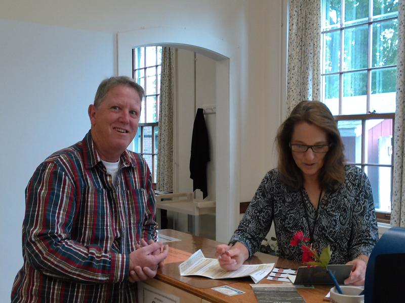 Edgecomb resident Steve Peters applies for a U.S. passport at the Lincoln County Registry of Probate. Deputy Register Jeannine Clark assists him. JANE CARPENTER/Boothbay Register