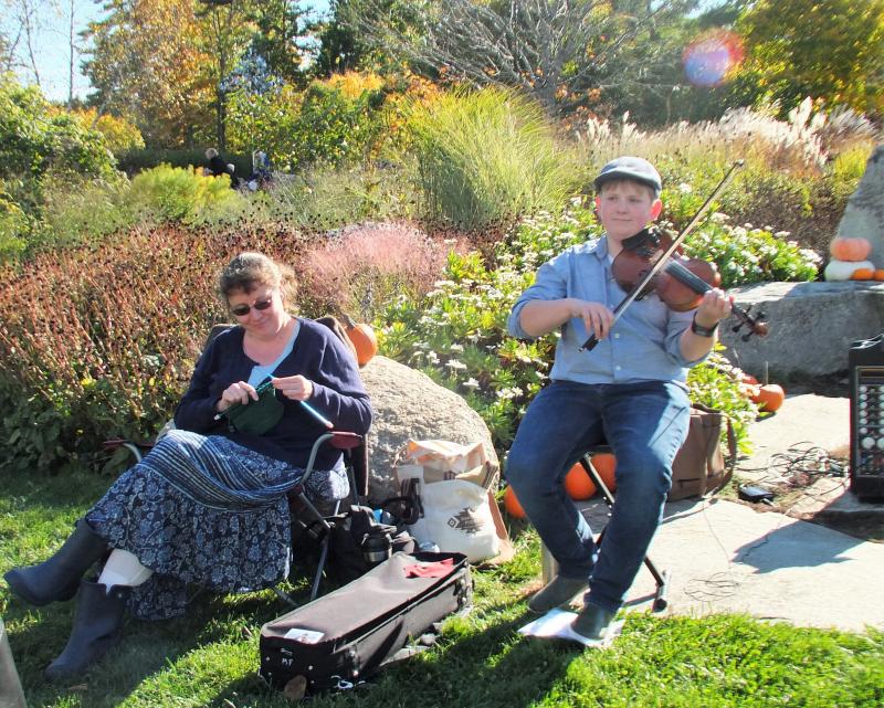 Fiddler Owen Kennedy, 13, and his mom Christina Kennedy at The Great Pumpkin Hunt. LISA KRISTOFF/Boothbay Register The Great Pumpkin Hunt at Coastal Maine Botanical Gardens Oct. 20.