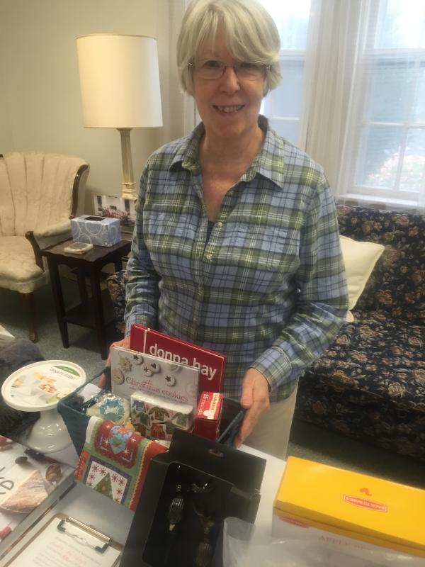 Wiscasset's Emily Adler tends the silent auction. SUSAN JOHNS/Wiscasset Newspaper