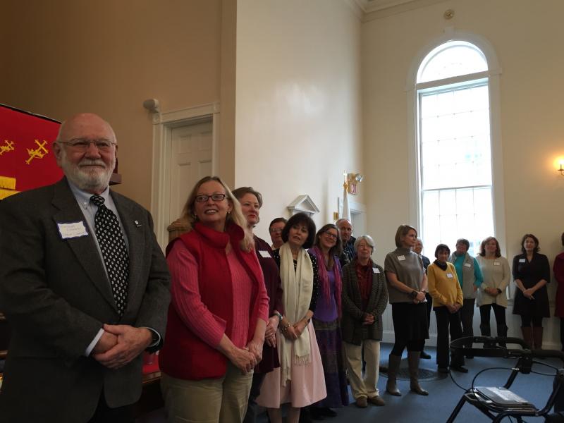 Representatives of area organizations await donations the church raised at Summerfest. SUSAN JOHNS/Wiscasset Newspaper