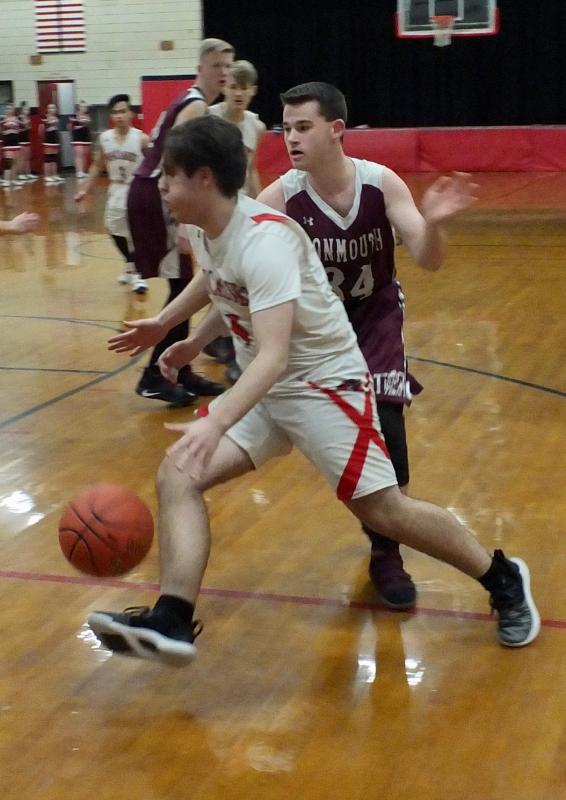 Billy Pinkham breaks with the ball by Monmouth’s Trevor Flanagan. PHIL DI VECE/Wiscasset Newspaper