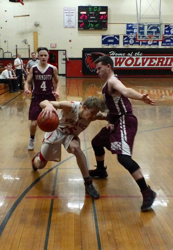 Toe to toe are Wiscasset's Matt Chapman and Monmouth Academy’s Trevor Flanagan. That’s Monmouth’s Dylan Lajoie in the background. PHIL DI VECE/Wiscasset Newspaper