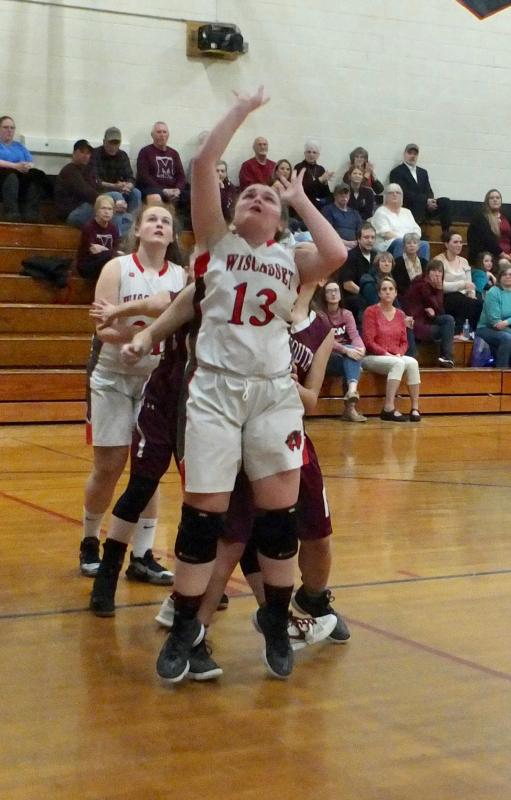 Jade Rego attempts a basket for Wiscasset. Behind her is teammate Maddy Carrier. PHIL DI VECE/Wiscasset Newspaper