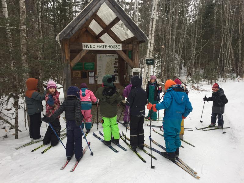 Students gather at the HVNC gatehouse at the start of the day to discuss trail conditions, weather, and itineraries. Courtesy of Juniper Hill School