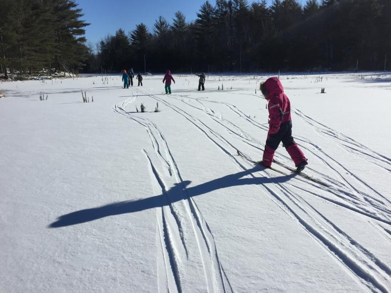 Skiing across new snow on Kidney Pond. Courtesy of Juniper Hill School
