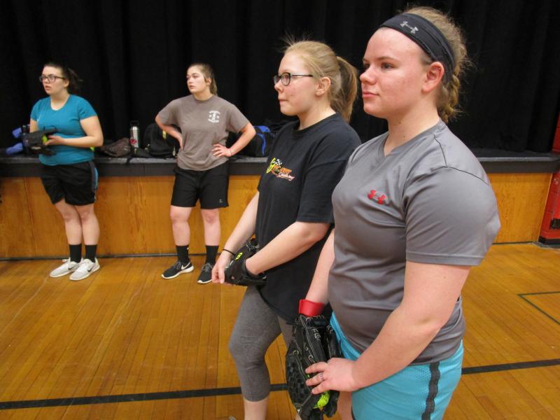 Ellie Pratt, left, Makayla Bailey, center, and Farrah Casey, three veterans from last year’s Wolverine softball team at a March 19 practice. Also shown is Joanna Collins. PHIL DI VECE/Wiscasset Newspaper
