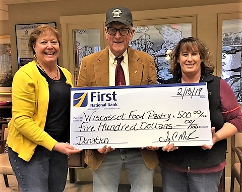 Wiscasset branch manager Monique McRae, left, and branch supervisor Ann Clifford, right, present Wiscasset Food Pantry with a $500 check from First National Bank. Courtesy photo