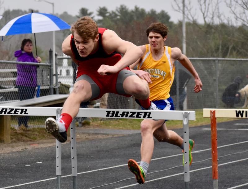 Wiscasset’s Matt Chapman won the 100-meter hurdles at Monday’s MVC track meet hosted by the Wolverines. Boothbay Region’s Quinn Ranta, also pictured placed second in the event. PHIL DI VECE/Wiscasset Newspaper