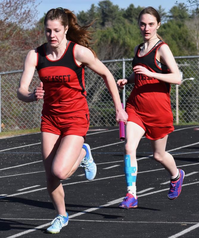 Cara Viele takes the baton from Lily Cooper in the 4x100 relay race. PHIL DI VECE/Wiscasset Newspaper