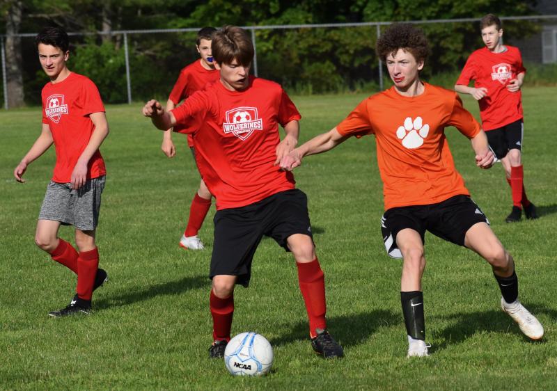 Wiscasset’s Mason Davenport, center; to his left is Chance Blagdon and at the far right is Matt Wright. PHIL DI VECE/Wiscasset Newspaper