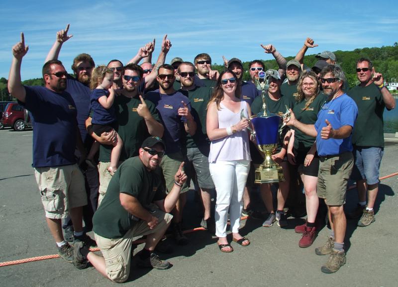 Who’s number one, two years running? Clear Stream Construction, that’s who! Stephanie Branch, center, returns the first place trophy to the team. LISA KRISTOFF/Boothbay Register