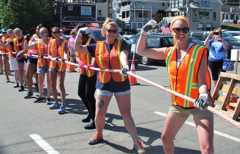 Working Gals team members flex up pre-pull. LISA KRISTOFF/Boothbay Register